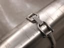 Close-up of the Gucci clasp on a metal wrist sizing gauge, showing a wrist fit of approximately 160mm or 16cm.