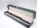 Gucci 3000 Jr watch presented inside a dark green watch box with cream interior.