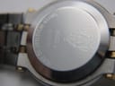 Close-up of the stainless steel case back of the Gucci 9000 L, showing 'Gucci', '9000 L', serial number '9054253', and 'Water Resistant to 3ATM' engravings.