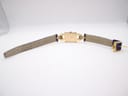 Full view of the Gucci 1800 L watch showing the case back and strap interior laid flat.