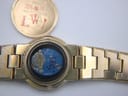Front view of the gold Gucci 3300L ladies' watch with its white Roman numeral dial and integrated bracelet.