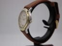 Close-up of the watch case back engraved with model 8000.2.M, serial number, and 'water resistant to 3 ATM'.