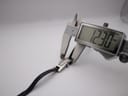 Digital caliper measuring the case width of the Gucci 3900L watch, precisely displaying 12.30mm.