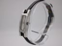 Angled view of Gucci 3900L watch showing side profile, original crown, and black leather strap on display.