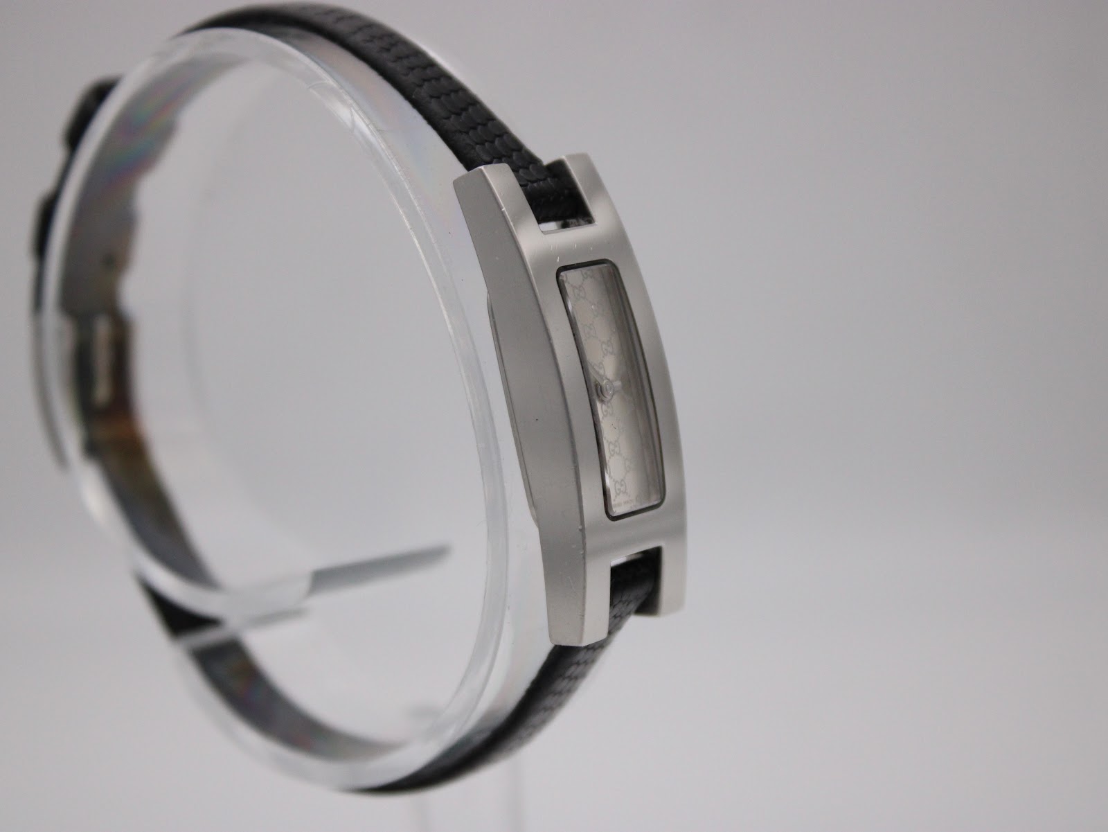 Another angled view of Gucci 3900L watch, highlighting the rectangular stainless steel case and strap.