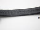 Close-up of the black leather strap, showing 'Gucci genuine leather' embossed text.