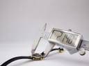Digital caliper measuring the Gucci 2000L watch case diameter at 21.40mm.