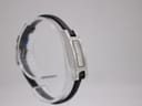 Another side-angled view of the Gucci 3900L on a clear stand, showing the other side of the rectangular case and the black leather strap.
