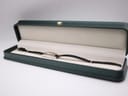 The Gucci 3900L watch displayed inside a dark green presentation box with a cream interior.