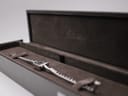 The Gucci G-Frame watch resting inside its original brown Gucci presentation box with embossed logo.