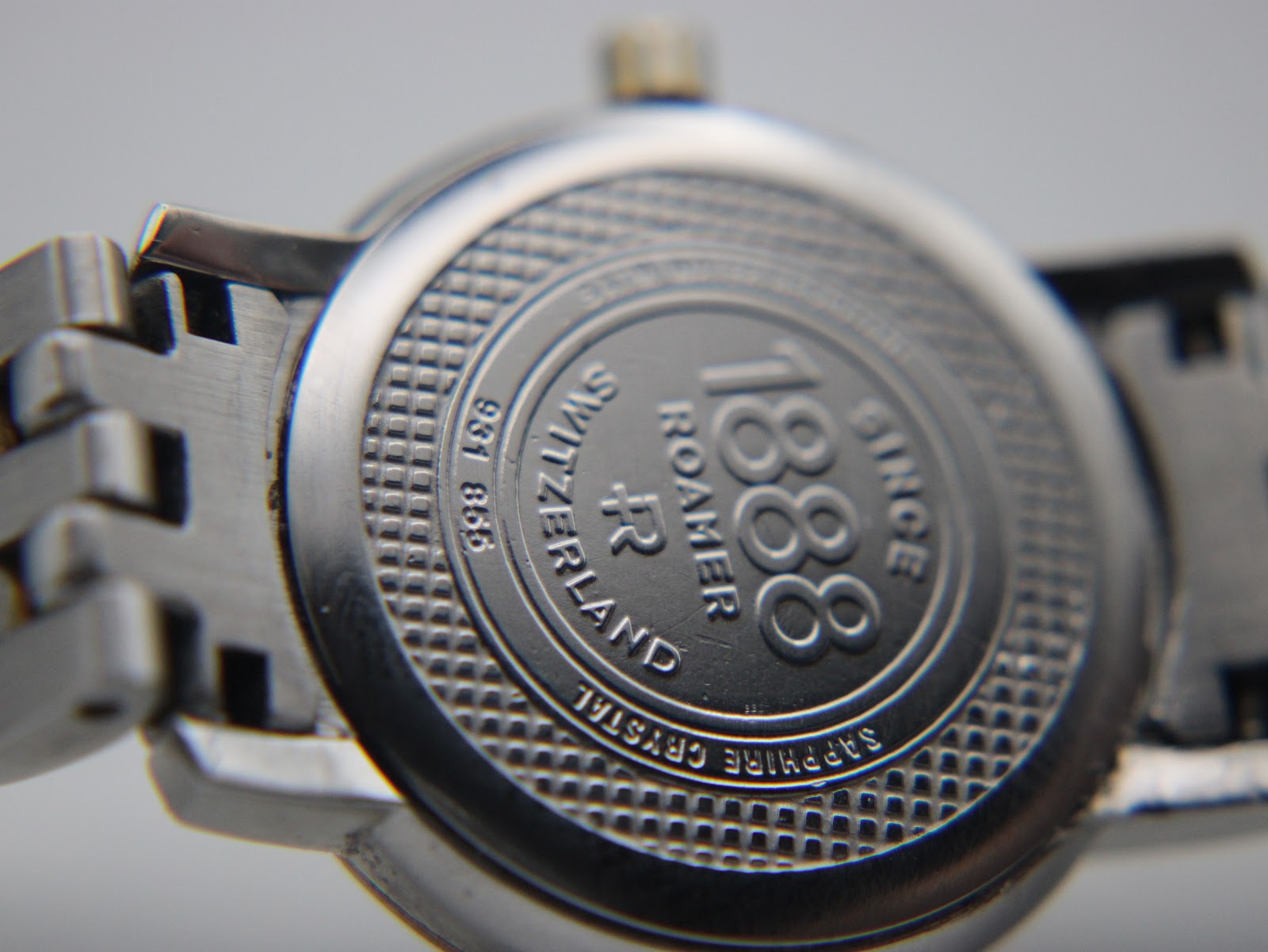 Close-up of the watch case back, engraved with 'Roamer since 1888', 'Switzerland', 'Sapphire Crystal', and the model number 831.855.