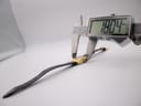 Side view of the watch being measured by a digital caliper, displaying a precise case diameter of 18.04 mm.