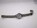 Full view of the Mondaine watch with stainless steel Milanese mesh bracelet laid out flat.