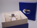 The Tissot watch neatly presented in its original blue Tissot branded box, with the box lid open in the background.