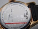 Close-up of the watch case back showing "TISSOT 1853", model "T085210 A", serial, "Sapphire Crystal", and "Water-Resistant 3bar (30m/100ft)".