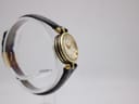 Left side profile of the Gucci 2000L watch, showcasing the gold-tone case and the elegant lines of the watch.