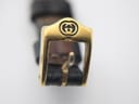 Front view of the original gold-tone Gucci buckle with the iconic interlocking G logo.