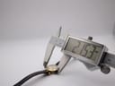 Digital caliper measuring the case diameter of the Gucci 2000L watch at 21.53mm, showing precision measurement.