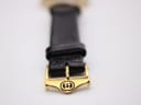 Close-up of the gold-tone buckle, prominently displaying the engraved interlocking Gucci 'G' logo.