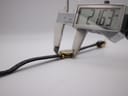 Digital caliper measuring the case diameter of the watch, displaying 21.63 mm.