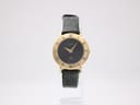 Front view of a Gucci 3000L ladies watch with a black dial and gold-plated round case.