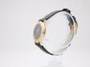 Side profile of the slim gold-plated Gucci 3000L case with original signed crown.