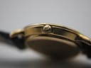 Angled view of the Gucci 3000L highlighting its vintage charm and strap connection.