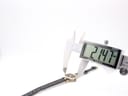 Digital caliper measuring the case diameter of the watch, displaying 21.47mm.
