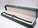 The Gucci 2000L watch presented inside a dark green watch box with a cream interior.