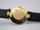 Close-up of the gold-tone case back of the Gucci 4500L, engraved with the model number '4500 L' and Gucci crest.