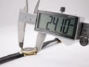 Digital caliper measuring the case diameter of the Gucci 4500L, displaying a precise reading of 24.10mm.