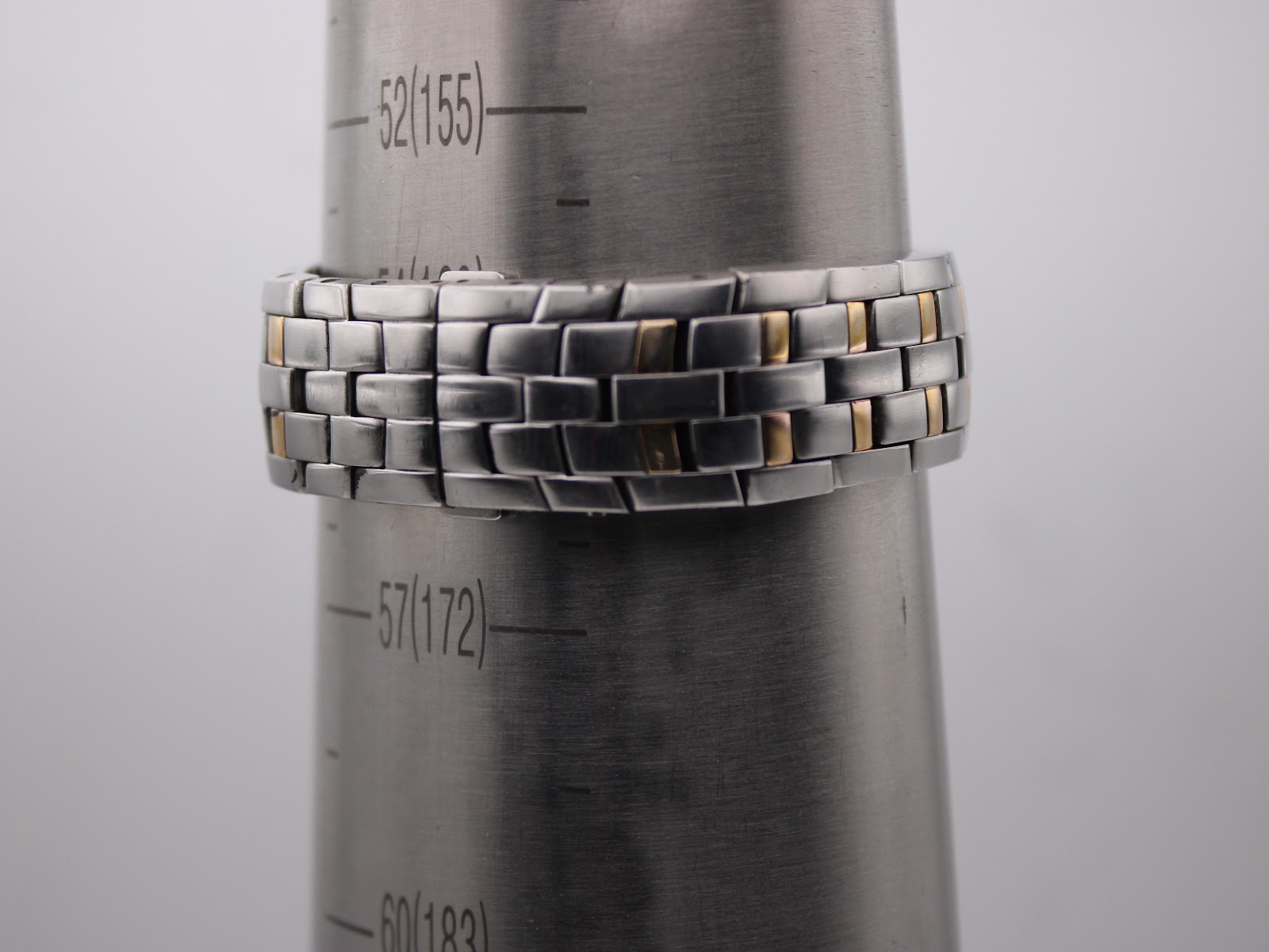 Maurice Lacroix watch bracelet shown on a wrist sizing cone, indicating a circumference of approximately 15.5cm (155mm).