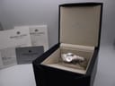 The Maurice Lacroix watch presented inside its original black display box, with manuals and guarantee card visible.