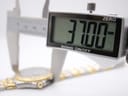 Close-up of a digital caliper measuring the watch case diameter at 37.00mm.
