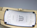 Close-up of the watch case back, revealing engravings like 'IN3012', 'Swiss Made', 'Sapphire Crystal', '10M Water Resistant', and 'Stainless Steel Case Top Gold Electroplated G20M'.