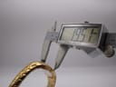 A digital caliper measuring the case width of the Maurice Lacroix watch, displaying a precise measurement of 19.51mm.