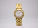 Front view of gold-tone Maurice Lacroix ladies' watch with white dial and gold hour markers on a clear stand.