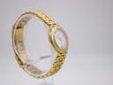 Another angled side view of the gold-tone Maurice Lacroix watch, highlighting the crown and bracelet links.