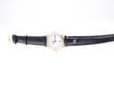 Overhead view of the Maurice Lacroix watch with its black leather strap laid flat, showcasing the full length and the gold buckle.