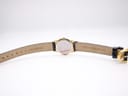 Underside view of the watch strap laid flat, showing "14 CUIR VERITABLE" and "MAURICE LACROIX Switzerland" printed on the black leather lining.