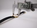Digital caliper measuring the watch case diameter at 25.63mm, confirming the precise size.