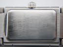 Close-up of the watch's brushed stainless steel case back, showing Maurice Lacroix branding, model number 32823, serial AB86210, 50m water resistance, and sapphire crystal