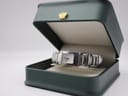 The Maurice Lacroix watch presented in a dark green display box