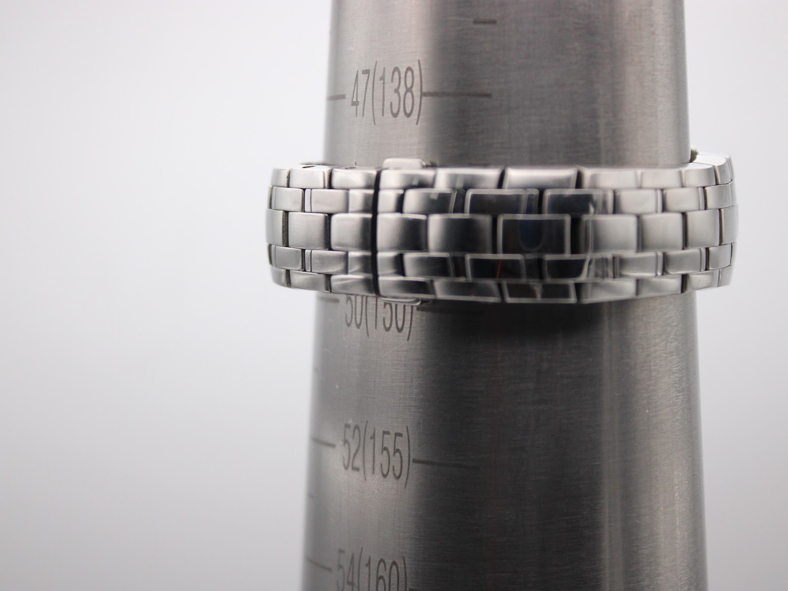 Watch bracelet on a sizing gauge, indicating a wrist circumference measurement of approximately 150mm.