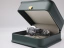 Maurice Lacroix watch presented in an open dark green display box, highlighting its elegant form.