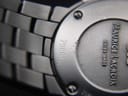 Angled close-up of the case back highlighting the model number '79861' and brushed finish of the bracelet links.
