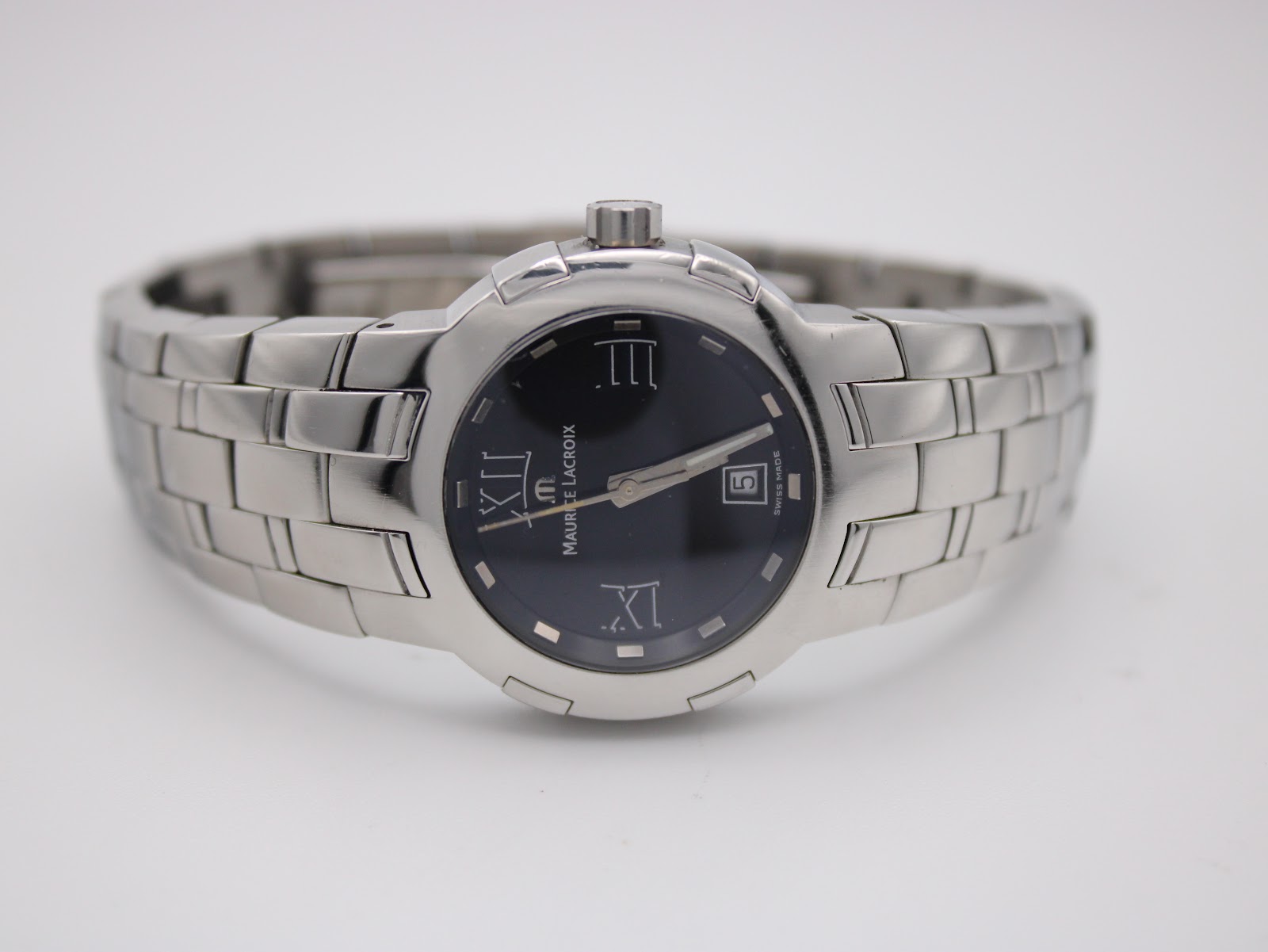 Front three-quarter view of the Maurice Lacroix watch, showcasing the sleek profile and integrated bracelet.