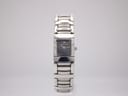 Front view of Maurice Lacroix watch with rectangular black dial and stainless steel bracelet.