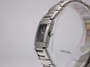 Right side profile view of Maurice Lacroix watch on a display stand, showing the signed crown.