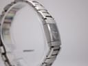 Left side profile view of Maurice Lacroix watch on a display stand, showing the integrated bracelet.